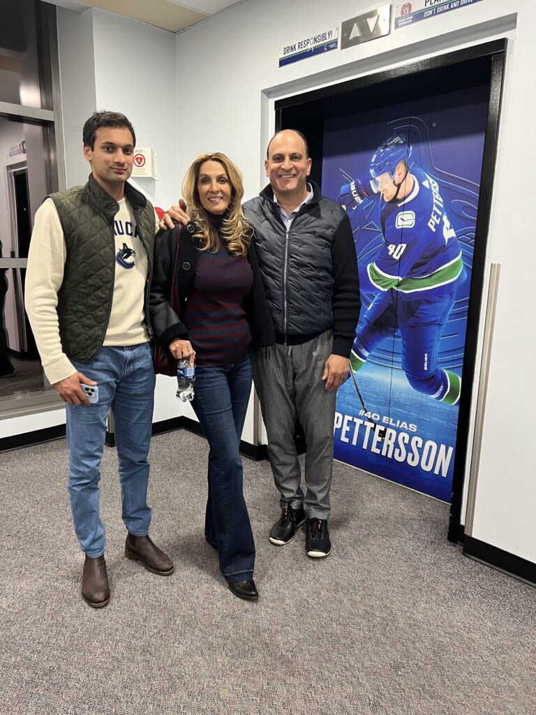David Sidoo enjoying the Vancouver Canucks game, supporting youth sports and community engagement.